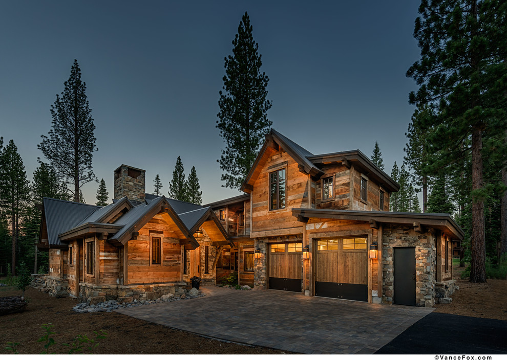 Design ideas for a large country two-storey brown exterior in Sacramento with wood siding and a gable roof.