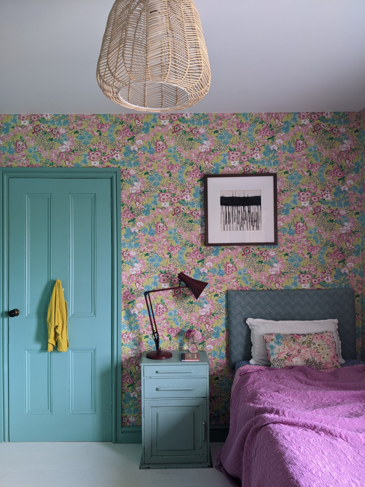 Inspiration for a country bedroom in Other with green walls, medium hardwood floors, white floor and wallpaper.