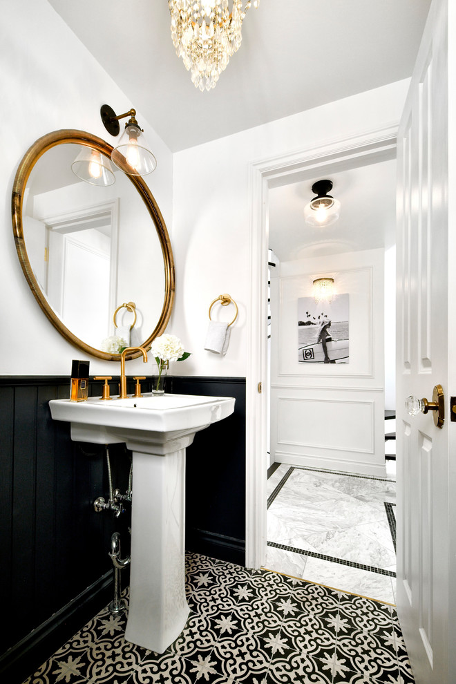 Traditional powder room in Tokyo with white walls, cement tiles, black floor and a console sink.
