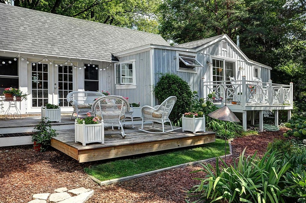 Photo of a mid-sized beach style side yard deck in Milwaukee with a container garden and no cover.