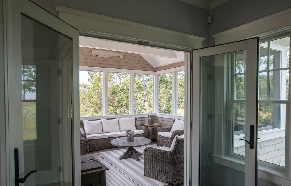 Mid-sized transitional backyard screened-in verandah in Boston with a roof extension.
