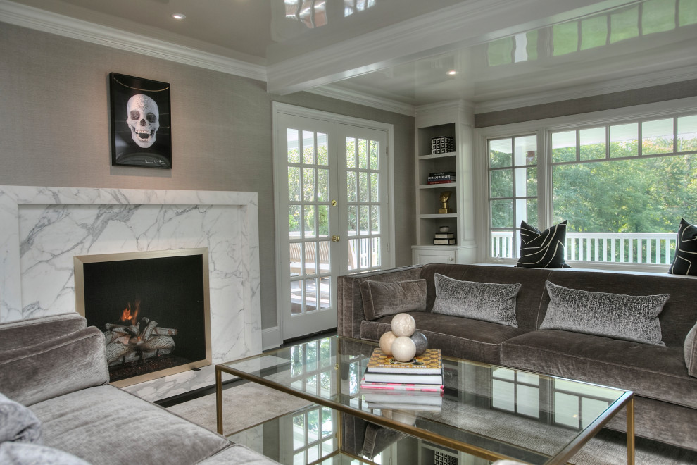 This is an example of a large transitional formal enclosed living room in New York with grey walls, dark hardwood floors, a standard fireplace, a stone fireplace surround, no tv and black floor.