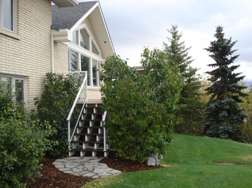 Mid-sized contemporary metal straight staircase in Calgary with open risers.