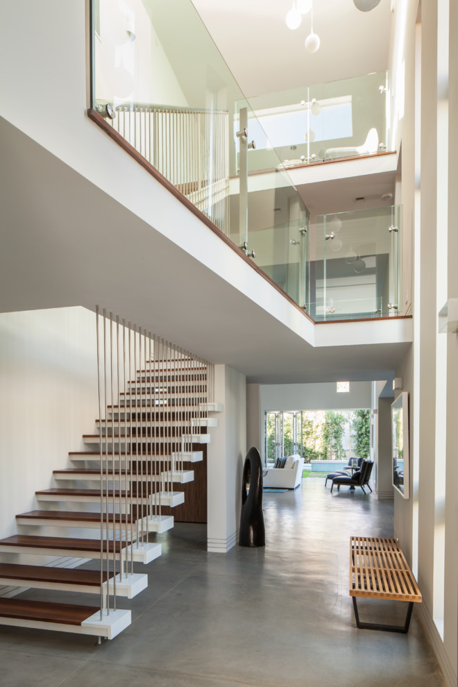Contemporary floating staircase in Los Angeles with open risers.