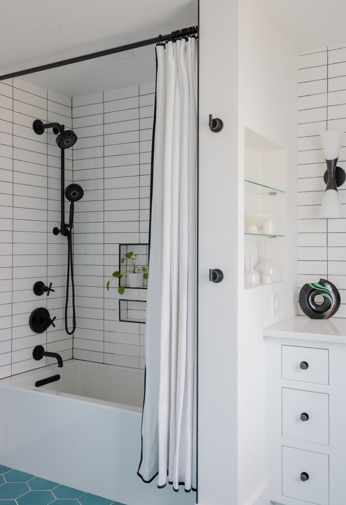 Design ideas for a mid-sized modern kids bathroom in Boston with recessed-panel cabinets, white cabinets, an alcove tub, a shower/bathtub combo, a two-piece toilet, white tile, ceramic tile, white walls, ceramic floors, an undermount sink, engineered quartz benchtops, turquoise floor, a shower curtain, white benchtops, a niche, a single vanity and a built-in vanity.