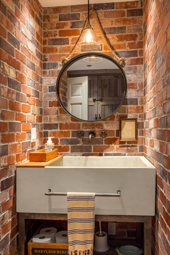 This is an example of a country powder room in Seattle with open cabinets.