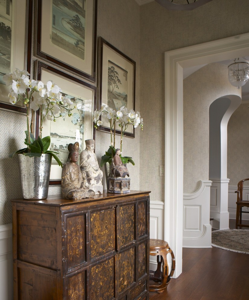 Design ideas for a large traditional hallway in New York with beige walls, medium hardwood floors and brown floor.