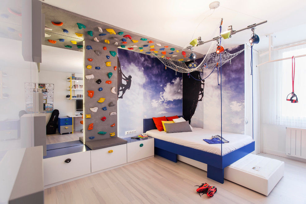 This is an example of a contemporary kids' room for boys in Other with multi-coloured walls, light hardwood floors and beige floor.