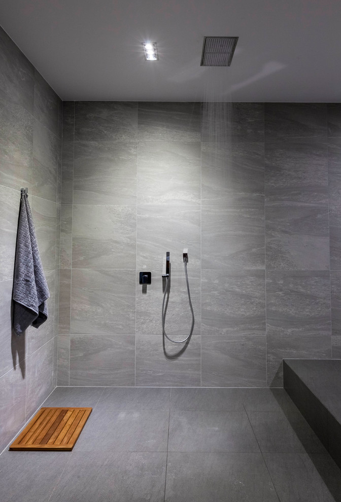 Design ideas for a large contemporary master bathroom in Gold Coast - Tweed with a drop-in tub, an open shower, gray tile, porcelain tile, grey walls and porcelain floors.