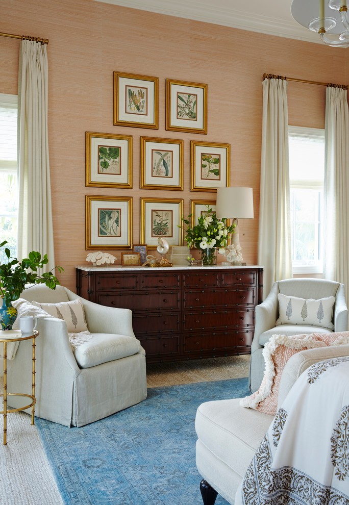 Design ideas for an expansive traditional master bedroom in Miami with pink walls and carpet.