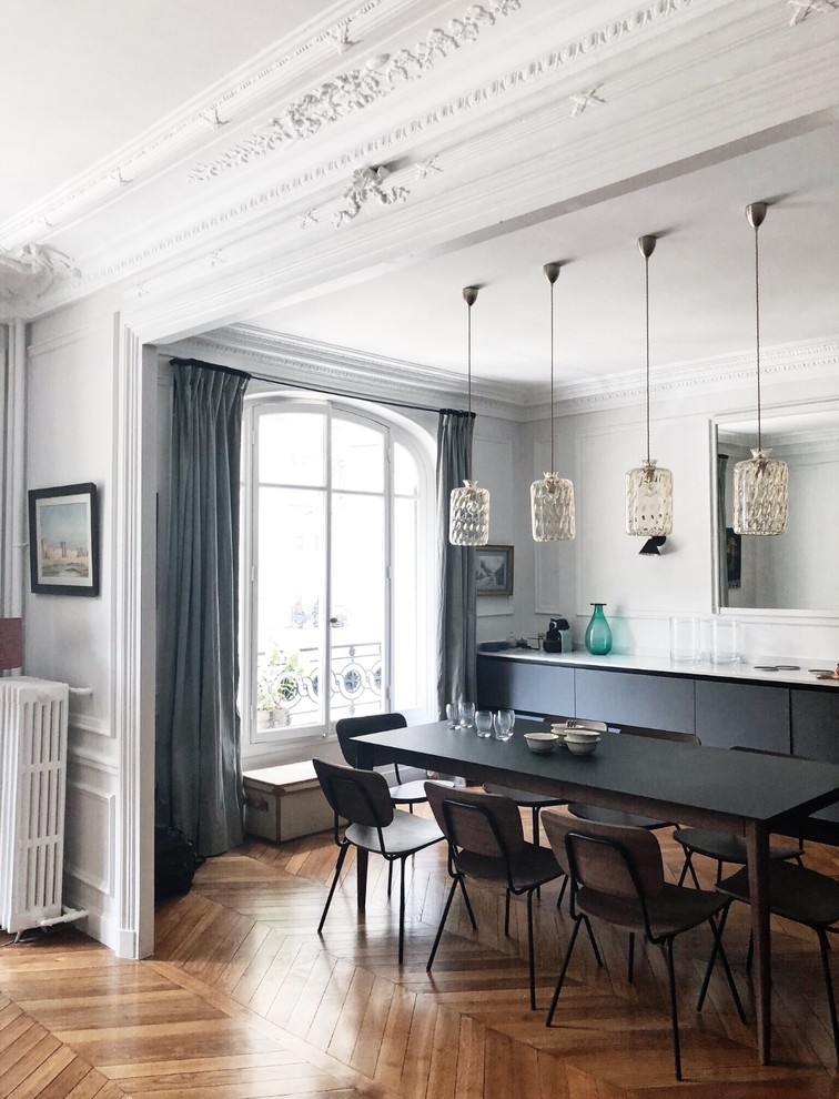 Photo of a scandinavian dining room in Paris.