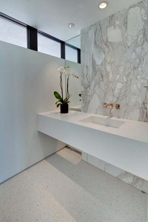 Design ideas for a mid-sized modern master bathroom in Los Angeles with beige tile, stone slab, white walls, concrete floors, an integrated sink, solid surface benchtops, white floor and white benchtops.