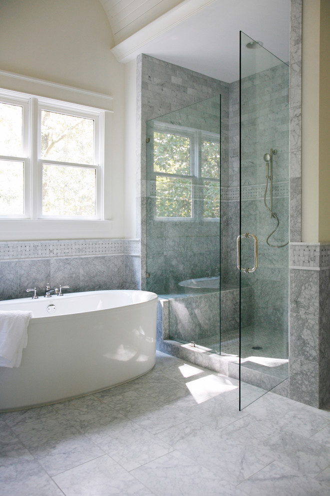 Design ideas for an expansive traditional master bathroom in Atlanta with marble benchtops, black and white tile, stone tile, yellow walls and marble floors.