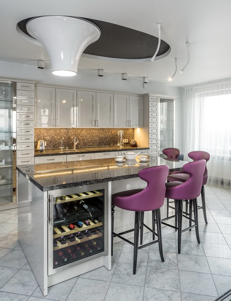 Inspiration for a mid-sized contemporary single-wall eat-in kitchen in Other with an undermount sink, white cabinets, multi-coloured splashback, with island and recessed-panel cabinets.
