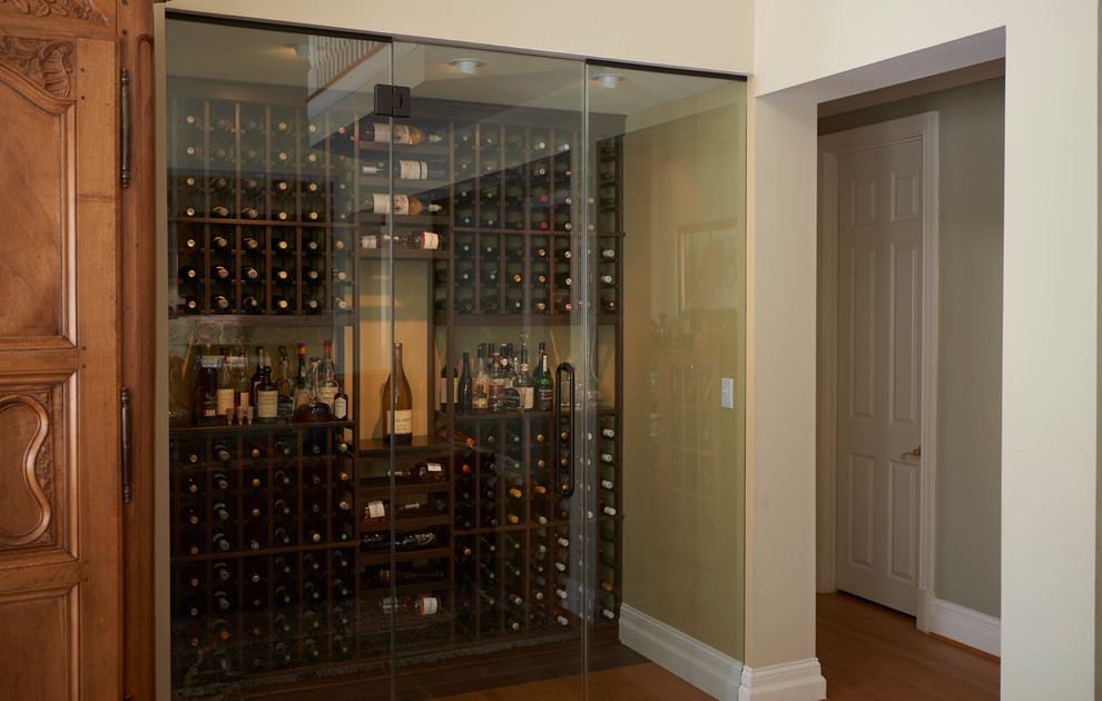 Design ideas for a small transitional wine cellar in Baltimore with medium hardwood floors and storage racks.