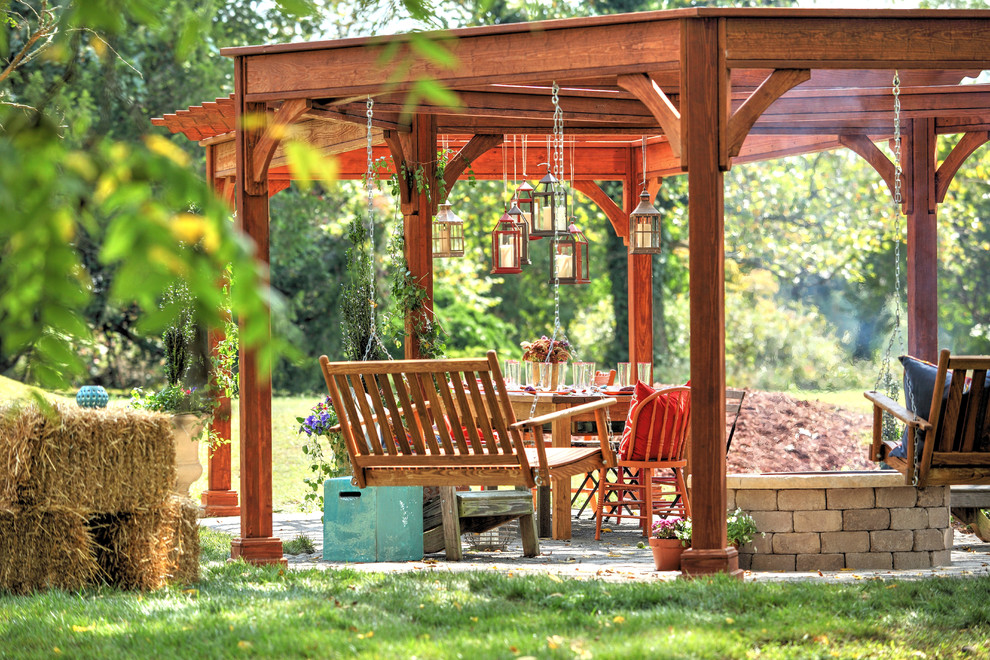 Photo of a mid-sized country backyard patio in Richmond with a pergola.