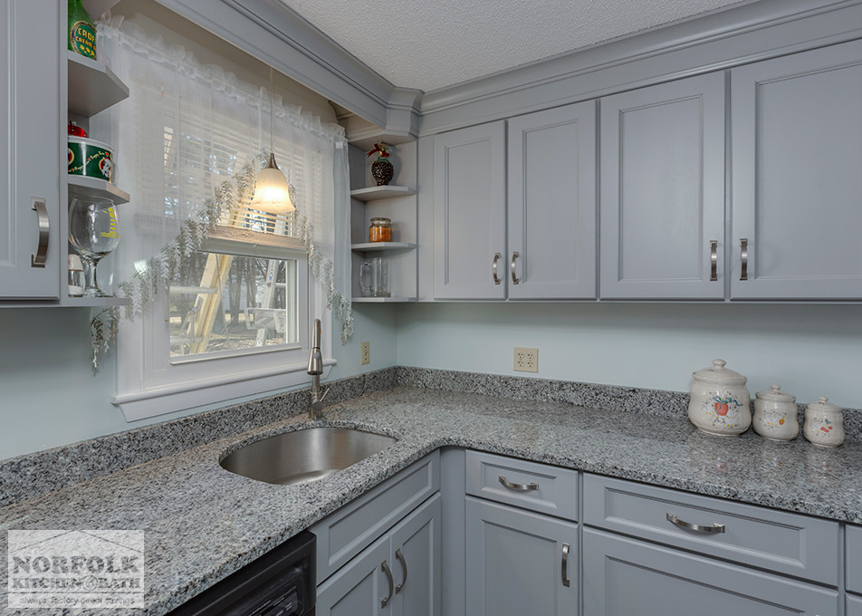 Inspiration for a mid-sized transitional u-shaped home design remodel in Boston with an undermount sink, shaker cabinets, gray cabinets, granite countertops, stainless steel appliances and no island