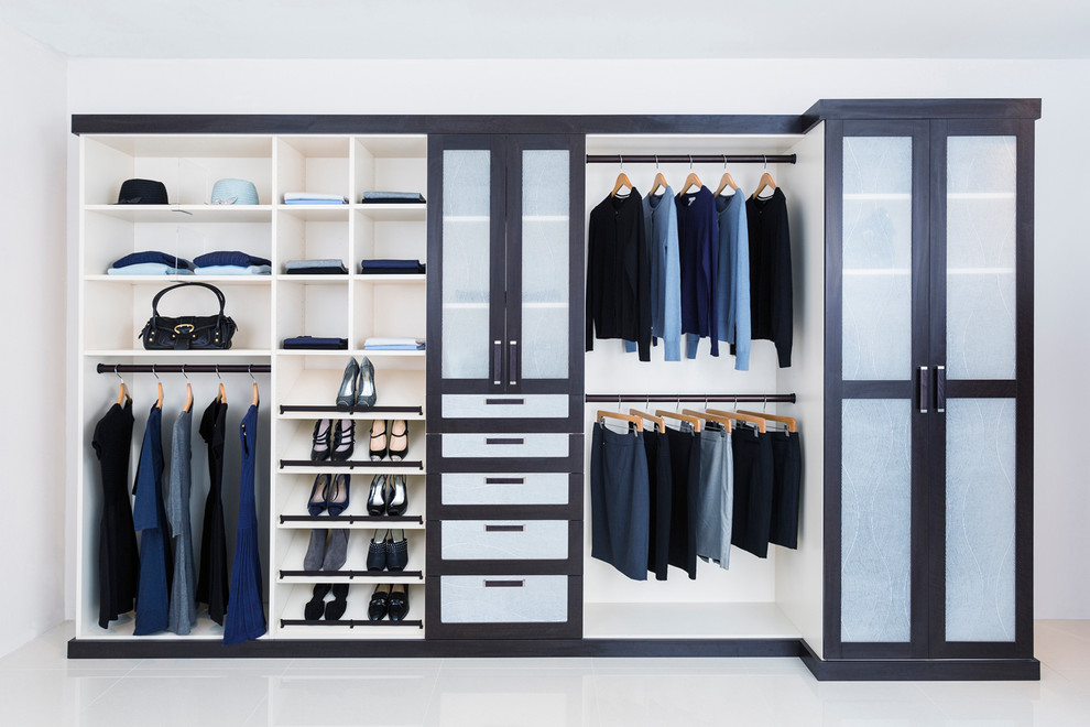 Example of a reach-in closet design in Richmond with beaded inset cabinets and blue cabinets