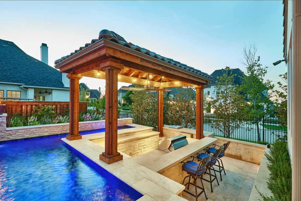 Design ideas for a modern custom-shaped pool in Dallas with natural stone pavers.