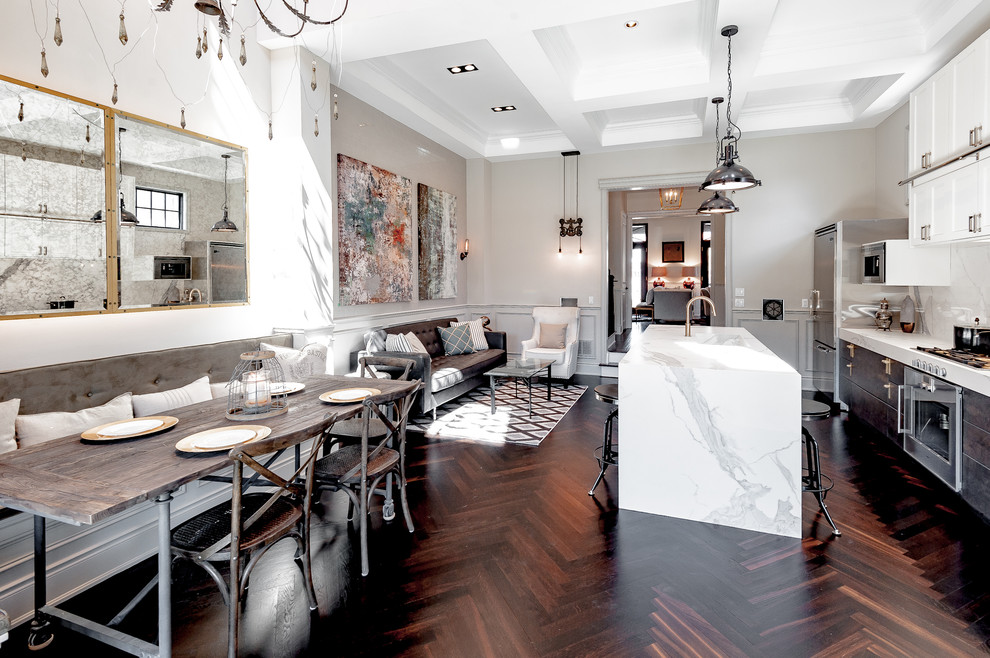 Transitional open plan dining in Toronto with white walls and medium hardwood floors.