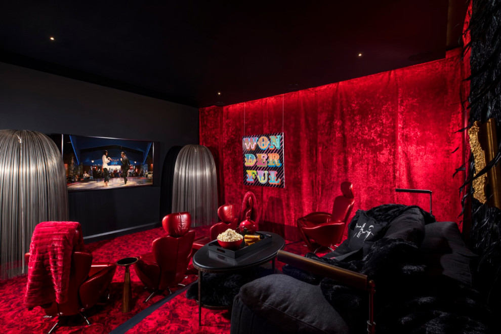 This is an example of a mid-sized contemporary enclosed home theatre in Tampa with red walls, carpet, a wall-mounted tv and red floor.
