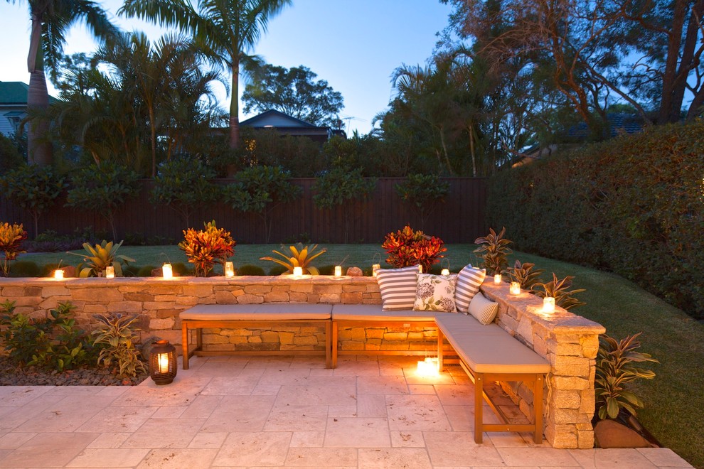 Inspiration for a mid-sized tropical backyard patio in Brisbane.