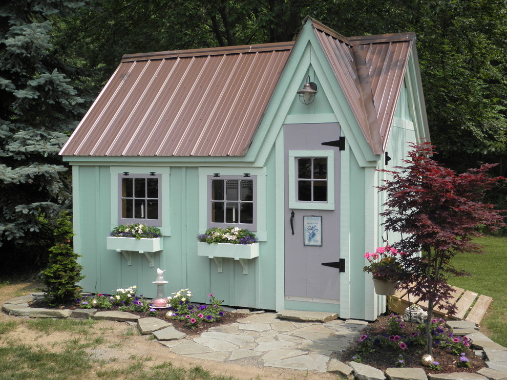 Small eclectic garden in Philadelphia with with outdoor playset.