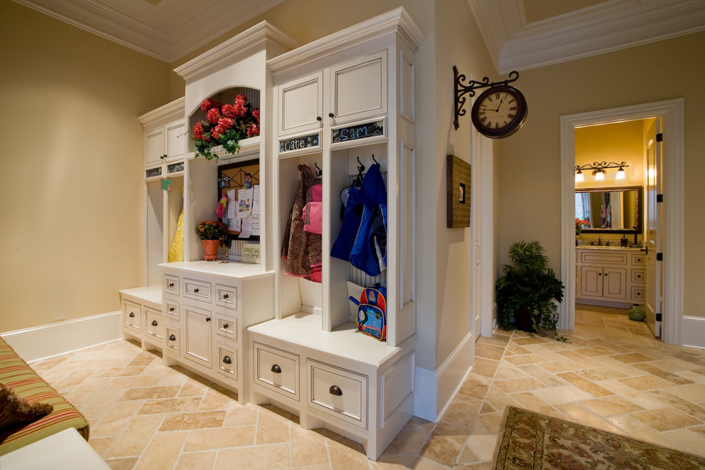 Photo of a mid-sized traditional mudroom in Nashville with beige walls and ceramic floors.