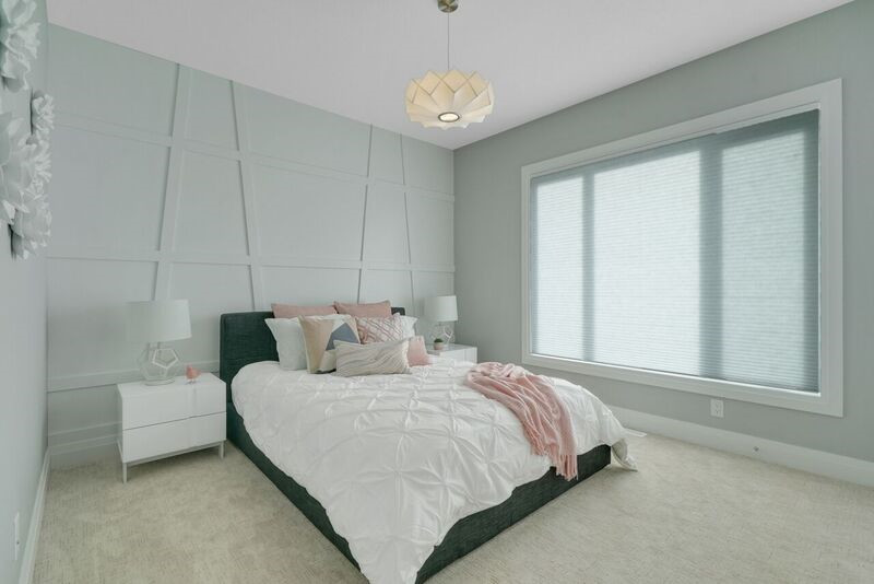 Photo of a transitional guest bedroom in Edmonton with grey walls, carpet and beige floor.
