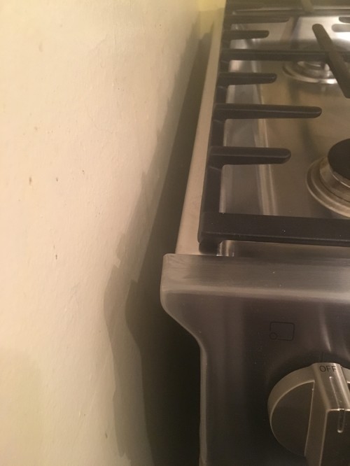 Gap between wall and slide in range. Filler ideas?