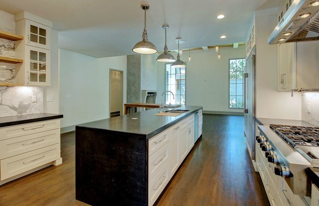 Enclosed kitchen - large contemporary l-shaped medium tone wood floor enclosed kitchen idea in Other with an undermount sink, beaded inset cabinets, white cabinets, granite countertops, white backsplash, stone slab backsplash, stainless steel appliances and an island