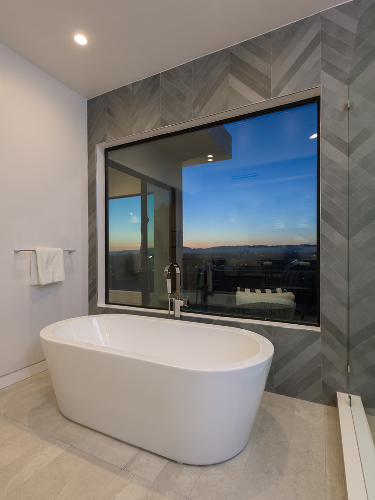 Large modern master bathroom in Los Angeles with grey walls.