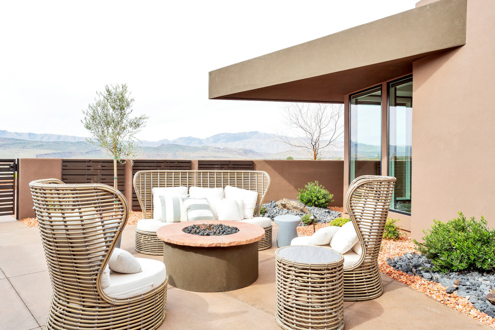 Inspiration for a contemporary patio in Salt Lake City with a fire feature, concrete slab and no cover.