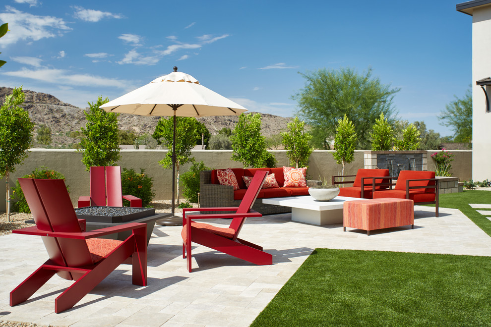 Inspiration for a transitional backyard stone patio remodel in Phoenix with a fire pit and no cover