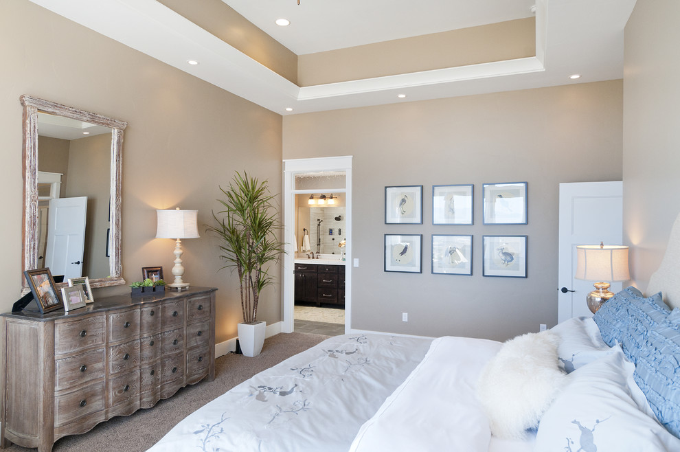 This is an example of a large arts and crafts master bedroom in Salt Lake City with beige walls, carpet and no fireplace.
