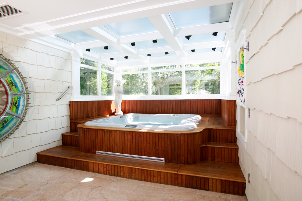 Design ideas for a mid-sized country indoor pool in New York with a hot tub and decking.