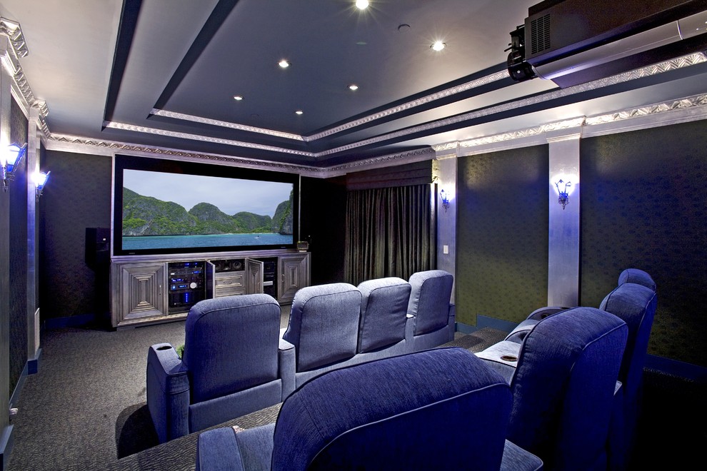 This is an example of an eclectic home theatre in Santa Barbara with a projector screen.