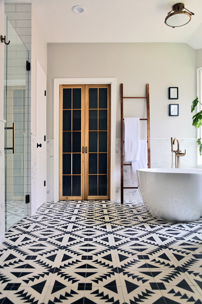 Photo of a mid-sized midcentury master bathroom in Other with flat-panel cabinets, grey cabinets, a freestanding tub, an alcove shower, black and white tile, subway tile, white walls, mosaic tile floors, an undermount sink, quartzite benchtops, white floor, a hinged shower door, white benchtops, a niche, a single vanity and a built-in vanity.