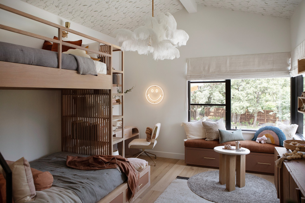 Hill Country Modern Meets Southlake, Texas - This Hill Country Modern home in Southlake combines modern design with comfort, featuring light-filled spaces and unique details reflecting the family's eclectic style for play and sophistication. 

This charming kids' room features cozy bunk beds adorned with soft bedding, a delightful window seat, whimsical lighting, and playful decor, all harmonizing in a serene neutral palette.