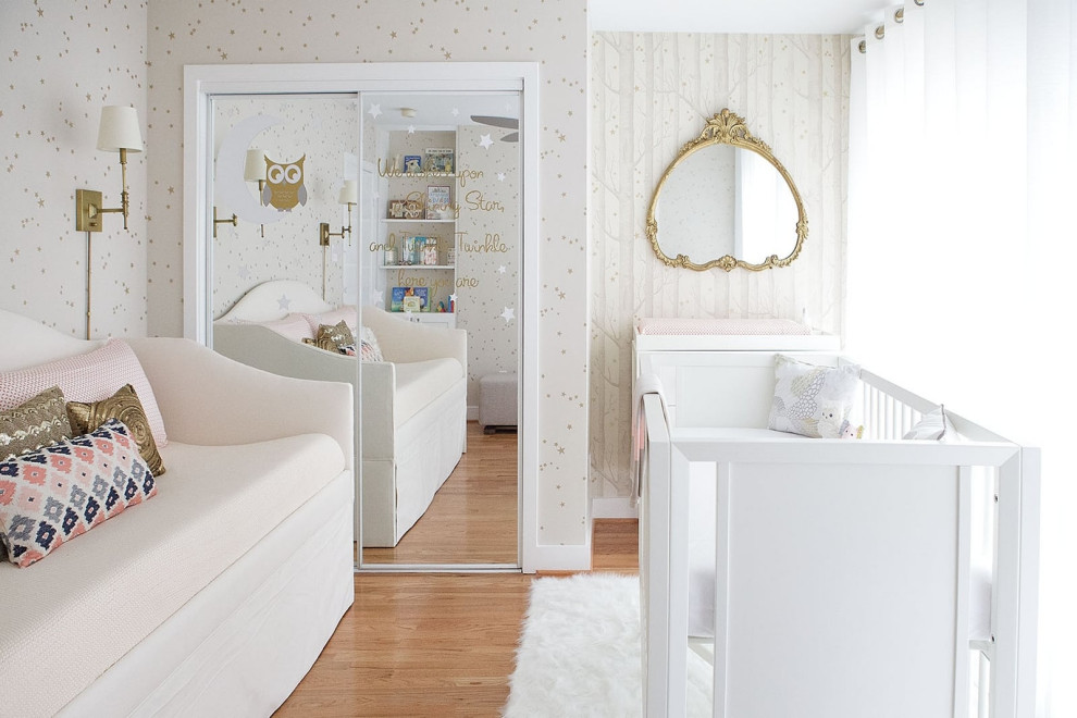 Inspiration for a mid-sized contemporary gender-neutral medium tone wood floor nursery remodel in San Francisco with white walls