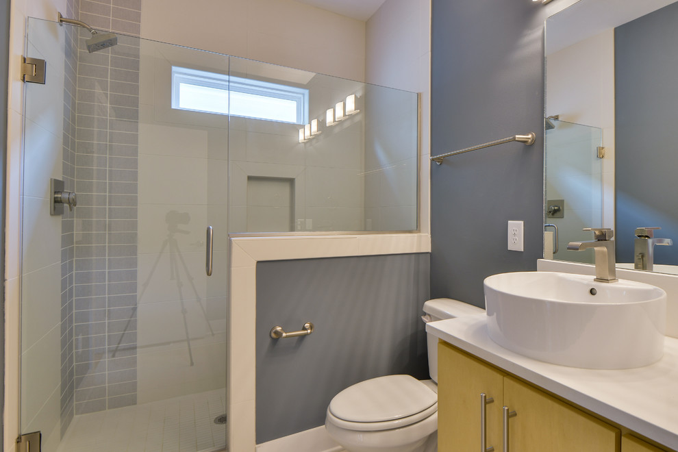 Design ideas for a small modern master bathroom in Nashville with a vessel sink, flat-panel cabinets, light wood cabinets, quartzite benchtops, an open shower, a two-piece toilet, white tile, porcelain tile, blue walls and porcelain floors.