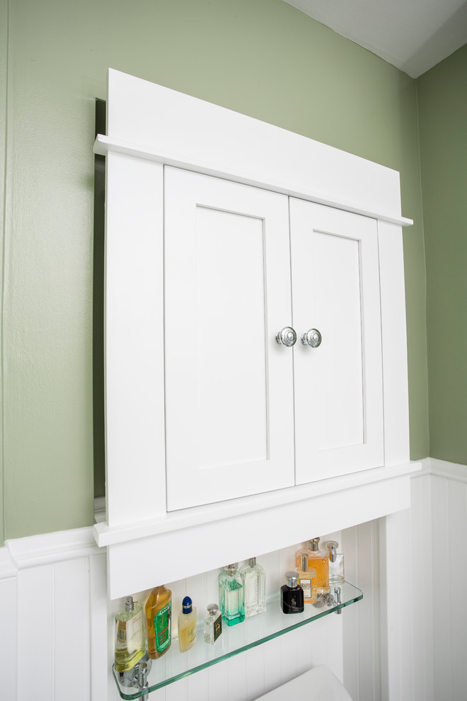 This is an example of a mid-sized traditional 3/4 bathroom in Minneapolis with shaker cabinets, white cabinets, an alcove shower, white tile, subway tile, green walls and ceramic floors.