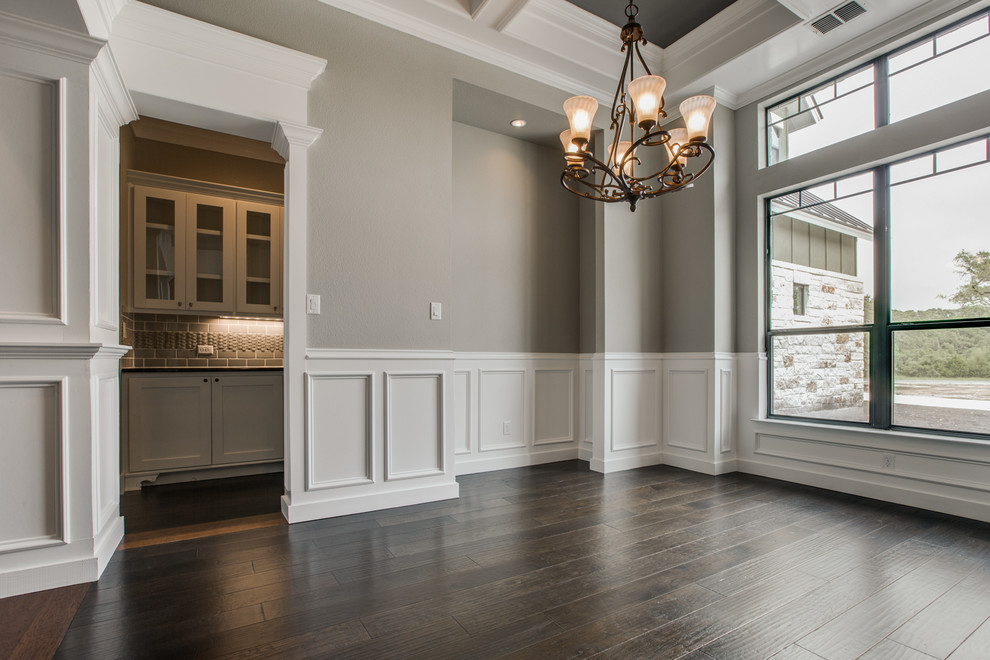 Design ideas for an arts and crafts dining room in Dallas with grey walls and dark hardwood floors.