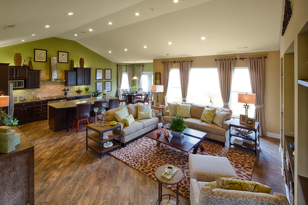 Example of a large transitional open concept living room design in Cleveland with no fireplace and a wall-mounted tv