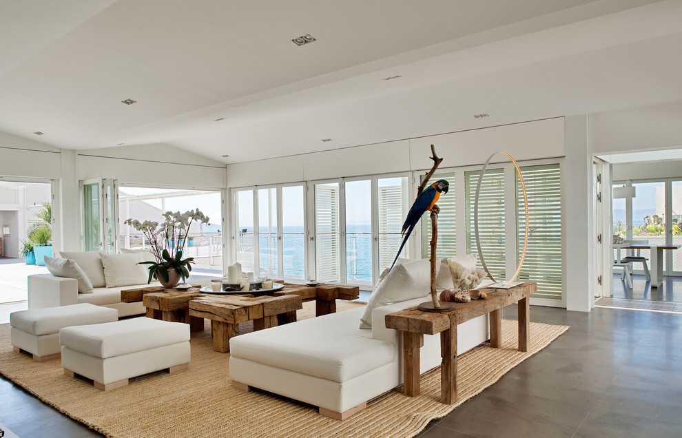 Photo of a large beach style formal open concept living room in Marseille with white walls, no fireplace and no tv.