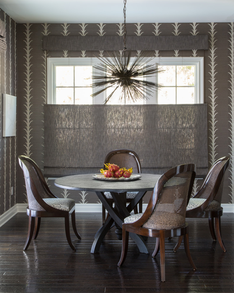 This is an example of a transitional dining room in Los Angeles with grey walls, dark hardwood floors and brown floor.