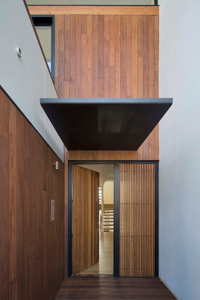 Inspiration for a contemporary front door in Sydney with medium hardwood floors, a single front door and a medium wood front door.
