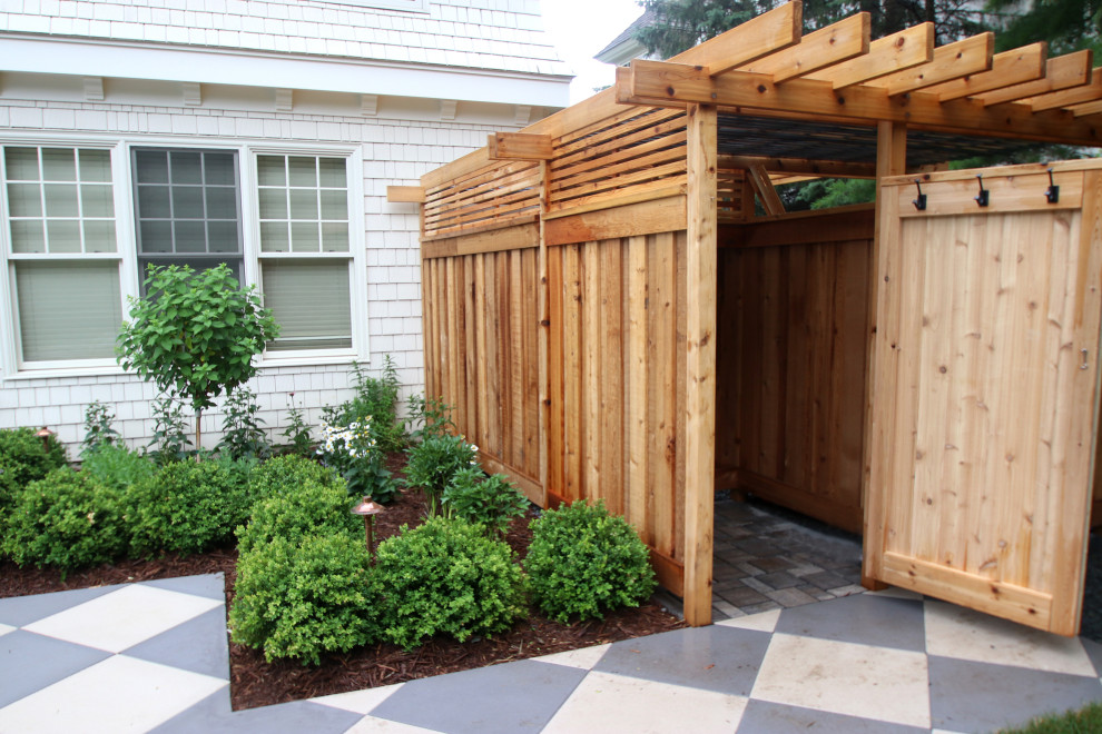 Idee per un giardino di medie dimensioni e dietro casa con pavimentazioni in mattoni e recinzione in legno