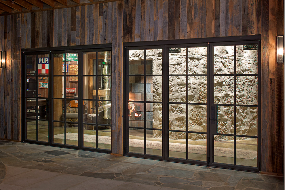 Design ideas for a country entryway in Austin with a metal front door.