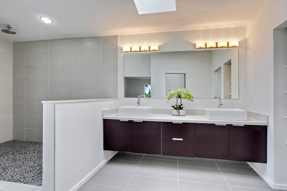 This is an example of a large modern master bathroom in Seattle with flat-panel cabinets, dark wood cabinets and white walls.